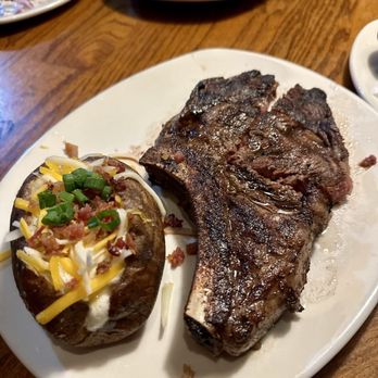 Outback Steakhouse - Bone-In Ribeye* 18 oz.with loaded baked potato - Steakhouses Near Me - Pleasant Hill, California
