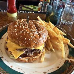 Wagyu smashburger and beef tallow fries. A classic old fashioned in the background.