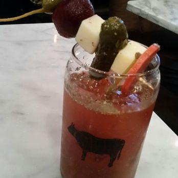 Meat & Potatoes - Kimchi bloody Mary with an obnoxious garnish - New American Near Me - Pittsburgh, Pennsylvania Meat & Potatoes - Kimchi bloody Mary with an obnoxious garnish - New American Near Me - Pittsburgh, Pennsylvania