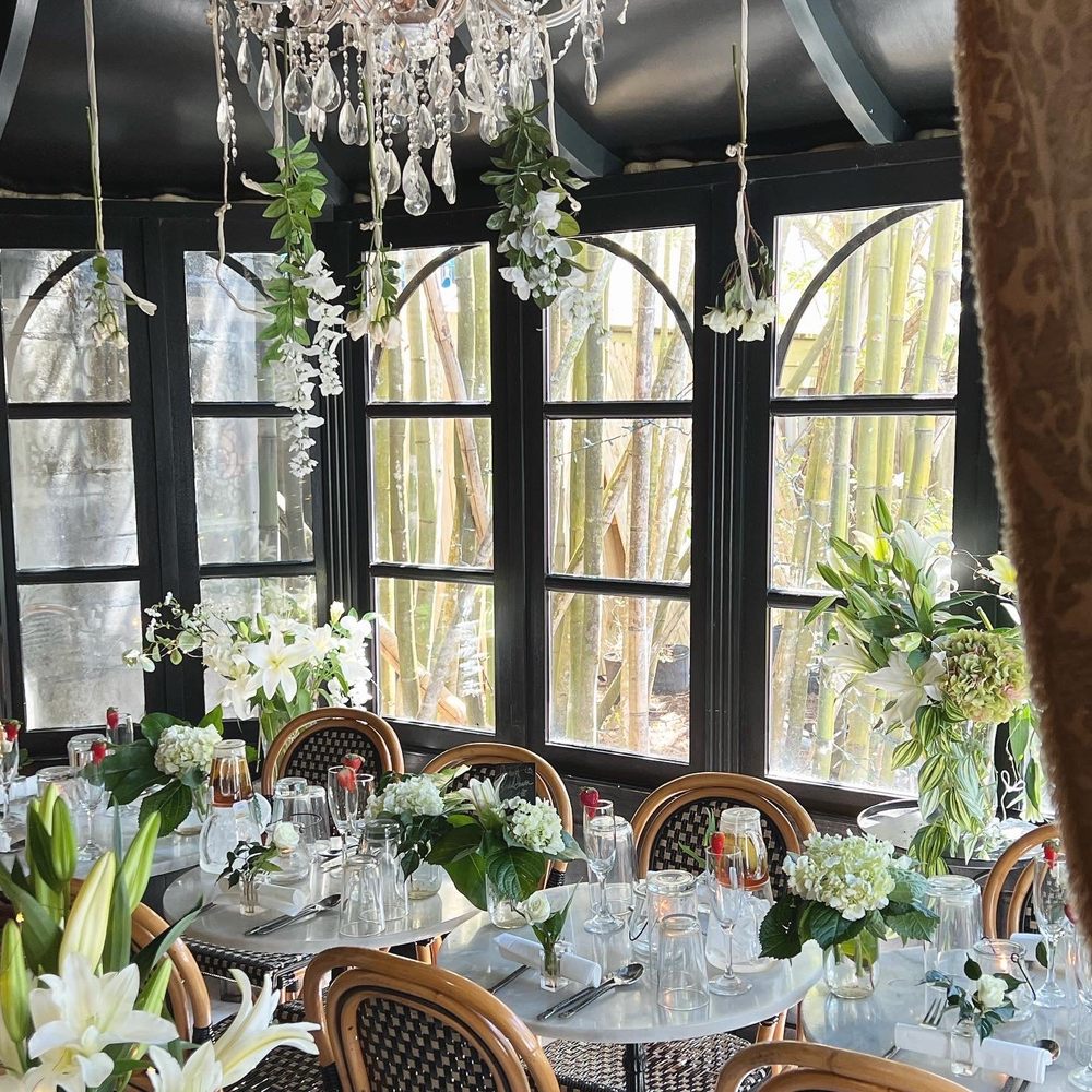 a dining room with a chandelier a dining room with a chandelier