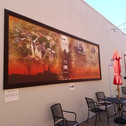 A large mural of historic photos (1 of 2 in the Alley)