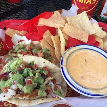 Mia's Table - Mia's red snapper tacos!! With chips and queso - American Near Me - Houston, Texas