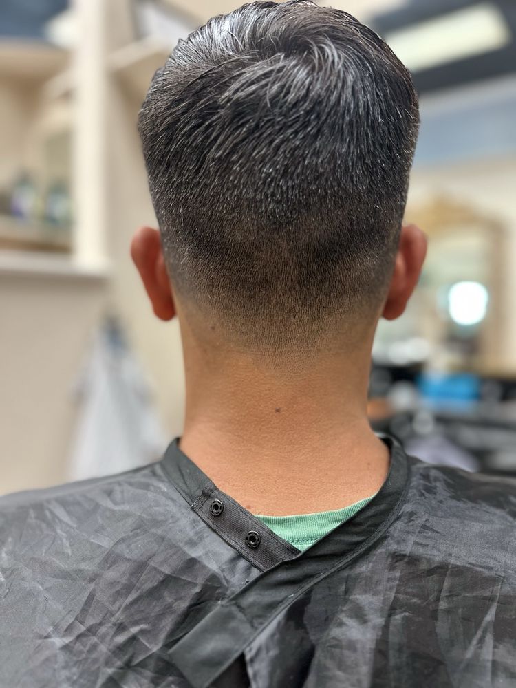 Southpaw Barber Leslie Mays Logo