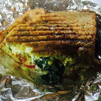 Pure Cold Press - Green street sandwich with tomato: fresh pesto and feta, avocado, spinach- pressed. It melts in your mouth! - Juice Bars & Smoothies Near Me - Brookline, Massachusetts Pure Cold Press - Green street sandwich with tomato: fresh pesto and feta, avocado, spinach- pressed. It melts in your mouth! - Juice Bars & Smoothies Near Me - Brookline, Massachusetts