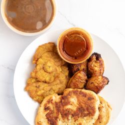 Flores Family Restaurant - Grilled chicken, tostones, sweet plantains, and steamed beans.