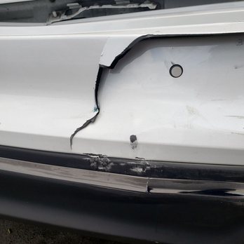 Metro Collision Experts - Close up of bumper impact - Body Shops Near Me - Chicago, Illinois Metro Collision Experts - Close up of bumper impact - Body Shops Near Me - Chicago, Illinois