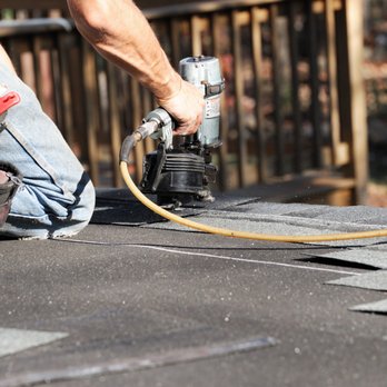 Butler Building and Engineering - a man working on a roof - General Contractors Near Me - Carlsbad, California