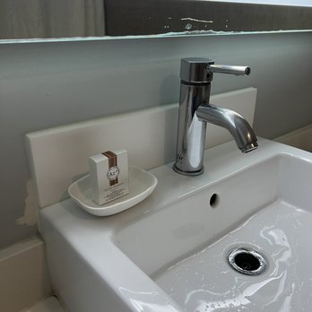 BLVD Hotel & Studios - The wall around the sink is patched and the work only partially done. The mirror is broken and dirty. - Hotels Near Me - Studio City, California BLVD Hotel & Studios - The wall around the sink is patched and the work only partially done. The mirror is broken and dirty. - Hotels Near Me - Studio City, California