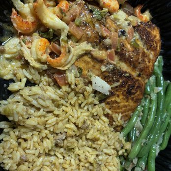 Orleans Seafood Kitchen - Blackened salmon topped with crawfish and crab, green beans and dirty rice - Cajun/Creole Near Me - Katy, Texas Orleans Seafood Kitchen - Blackened salmon topped with crawfish and crab, green beans and dirty rice - Cajun/Creole Near Me - Katy, Texas