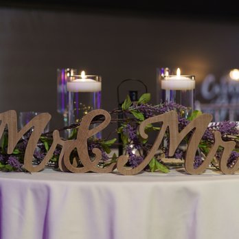 K. Pacho - a table with candles and a sign that says mr and mrs - Mexican Near Me - New Hyde Park, New York