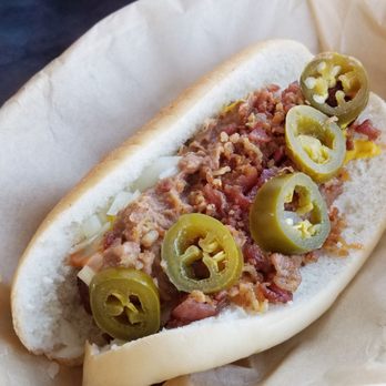 Simon's Hot Dogs - Sonoran Cousin (refried beans, onions, mustard, Simon's Sauce, bacon bites, and jalapeños) with a Colombian chorizo dog. - Hot Dogs Near Me - Gilbert, Arizona