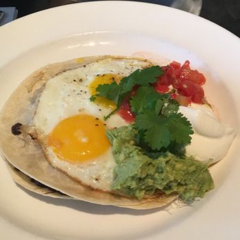 Mildred's Temple Kitchen - Huevos Monty. It doesn't look like much, but those beans underneath with that fresh avocado? BOMB. - Breakfast & Brunch Near Me - Toronto, Ontario