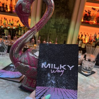 Milky Way Cocktail Bar - hand holding a menu - Cocktail Bars Near Me - Montreal, Quebec Milky Way Cocktail Bar - hand holding a menu - Cocktail Bars Near Me - Montreal, Quebec