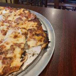 Pizza. Burnt on sides and bottom, too!