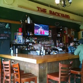 The Backyard - people sitting at a bar - Bars Near Me - Milwaukee, Wisconsin