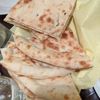 Anarkali Concord - Tandoori naan ($1) mixed w/ aloo naan ($4) which is stuffed with potatoes. Love that they cut the naan here for you. One naan = 4 pieces. - Pakistani Near Me - Concord, California