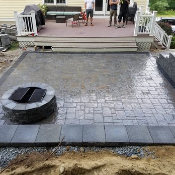 First Impressions Landscaping - a patio with a fire pit - Landscaping Near Me - Lowell, Massachusetts