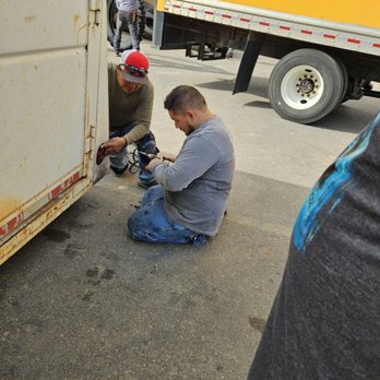 Heiser Tire Service - Stellar staff installing new light - Tires Near Me - Dalhart, Texas Heiser Tire Service - Stellar staff installing new light - Tires Near Me - Dalhart, Texas