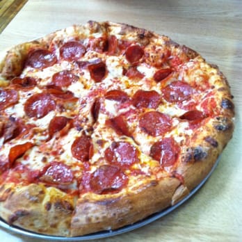 The Pizza Man - a pepperoni pizza on a table - Pizza Near Me - Clover, South Carolina The Pizza Man - a pepperoni pizza on a table - Pizza Near Me - Clover, South Carolina