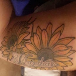 Abel added sunflowers around my mom's name, which was down a few years back. Abel added sunflowers around my mom's name, which was down a few years back.