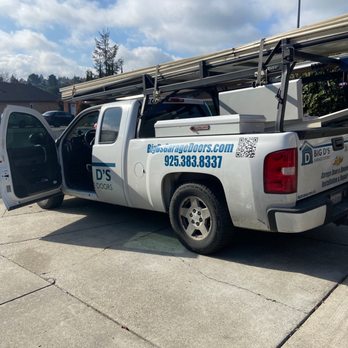 Big D's Garage Doors - Haiuling away the messed up door - Garage Door Services Near Me