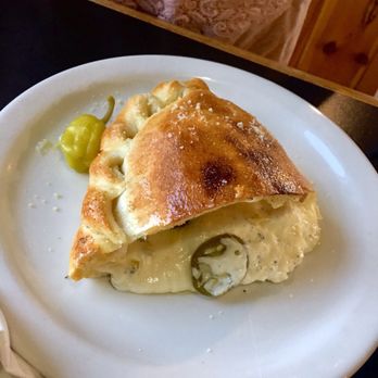 Thunderhead Brewing - Artichoke calzone, cut in half for me and my friend. $9. Added jalapeños for .50 - Pubs Near Me - Kearney, Nebraska Thunderhead Brewing - Artichoke calzone, cut in half for me and my friend. $9. Added jalapeños for .50 - Pubs Near Me - Kearney, Nebraska