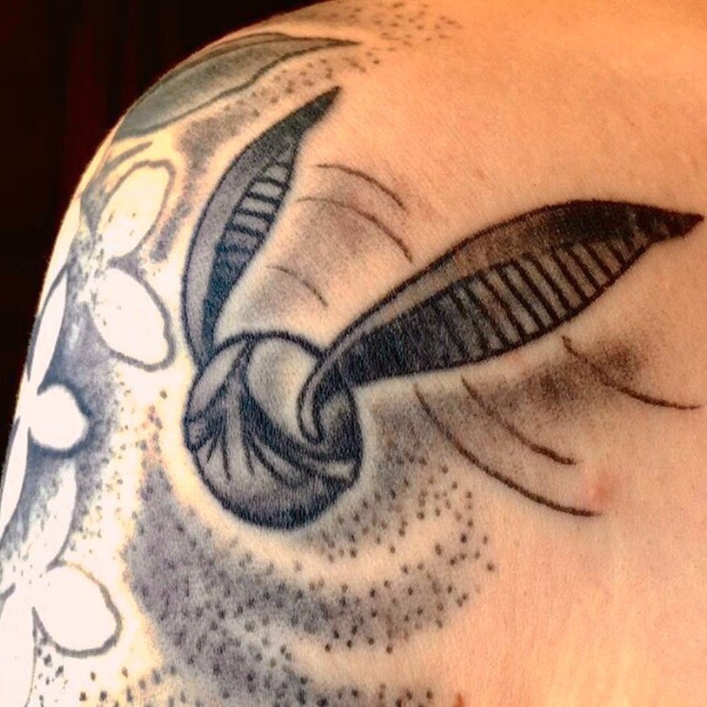 Iron Age Studios - Snitch by Caleb Quales, flowers in the background by Jason Bane - Tattoo Near Me - Saint Louis, Missouri Iron Age Studios - Snitch by Caleb Quales, flowers in the background by Jason Bane - Tattoo Near Me - Saint Louis, Missouri