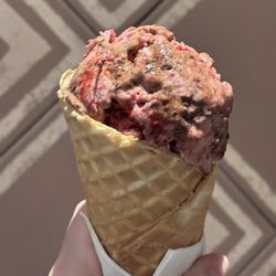 Cherry Red Velvet Cheesecake in a waffle cone