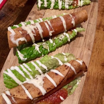 Jose and Sons - Chicken Flautas over romaine lettuce beds - New American Near Me - Raleigh, North Carolina