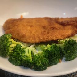 Curry Red Choo Chee Fish with mixed vegetables served with a table red