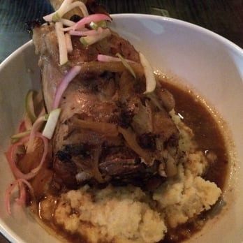 Not Your Average Joe's - Waltham - Braised pork shank with white corn polenta. - New American Near Me - Waltham, Massachusetts Not Your Average Joe's - Waltham - Braised pork shank with white corn polenta. - New American Near Me - Waltham, Massachusetts