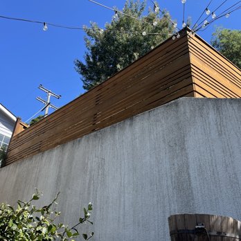 Wood Staining and Seal - Refinished area of upper back yard - Refinishing Services Near Me