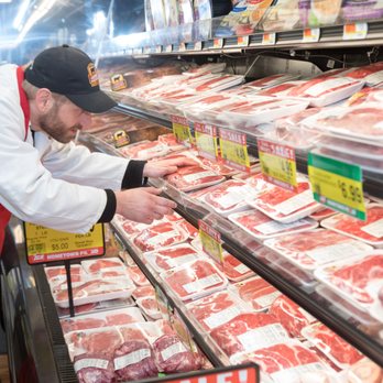 Adams Hometown Market - a butcher working in a meat section - Grocery Near Me - Adams, Massachusetts Adams Hometown Market - a butcher working in a meat section - Grocery Near Me - Adams, Massachusetts