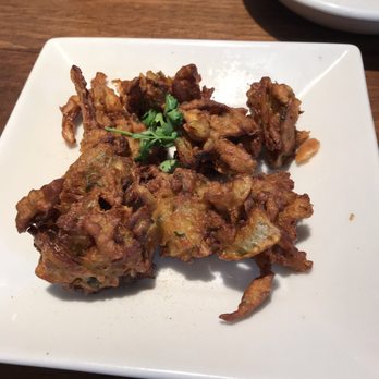 Roti Grill - One of the appetizers on the board. Fried onion. Tasty! - Indian Near Me - Frisco, Texas Roti Grill - One of the appetizers on the board. Fried onion. Tasty! - Indian Near Me - Frisco, Texas