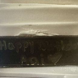 cake with chocolate plaque and message SCRIBBLED on it. cake with chocolate plaque and message SCRIBBLED on it.