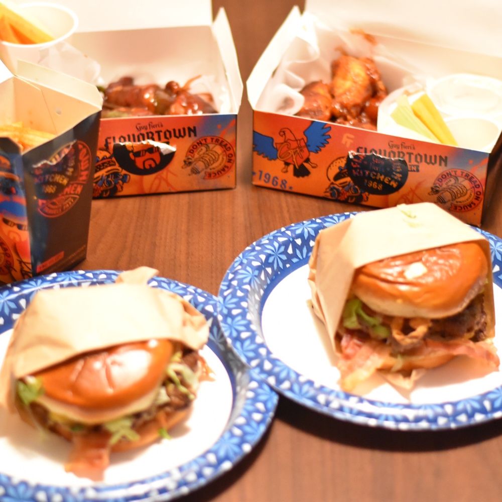 Guy Fieri's Flavortown Kitchen - Top (L-R): Flavortown Fries, Jalapeño Pig Poppers, Bourbon Brown Sugar BBQ Wings Bottom (L-R): Real Cheezy Burger, Bacon Mac N Cheese Burger - Food Delivery Services Near Me Guy Fieri's Flavortown Kitchen - Top (L-R): Flavortown Fries, Jalapeño Pig Poppers, Bourbon Brown Sugar BBQ Wings Bottom (L-R): Real Cheezy Burger, Bacon Mac N Cheese Burger - Food Delivery Services Near Me