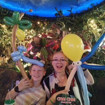 Rainforest Cafe - Jordan has a balloon monkey climbing a tree of bananas made while Grace had the octopus. They also enjoyed spending money in the gift shop. - American Near Me - Gurnee, Illinois Rainforest Cafe - Jordan has a balloon monkey climbing a tree of bananas made while Grace had the octopus. They also enjoyed spending money in the gift shop. - American Near Me - Gurnee, Illinois