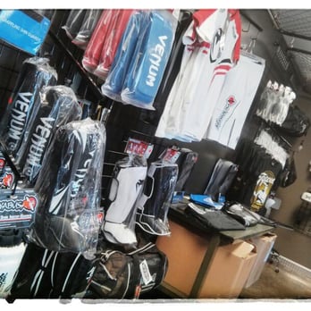 MMA Top Supplies - MMA Top Supplies store picture of products along wall - Sports Wear Near Me - Eagle, Idaho