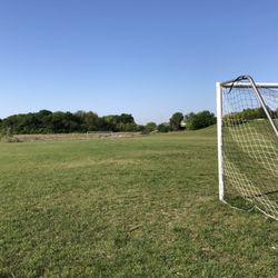 Chadwick Farms Park - Large mown grass field with soccer nets.