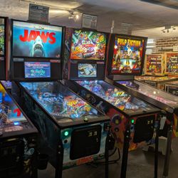 Decades Arcade - New Stern Pinball row with older 70s pins in the background
