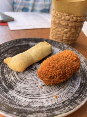 Photo of Sapori e Delizie - Rome, RM, IT. Zucchini flower stuffed with cheese and anchovies and suppli.  The zucchini flower is amazing