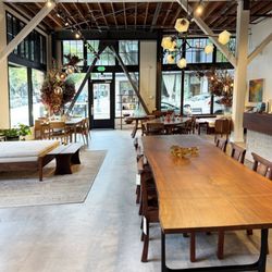 Photo of our Pearl District Showroom, featuring a Live-Edge Dining Table.