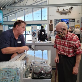 Dolphin Scuba Center - Rich D. helping my dad at the display case - Scuba Diving Near Me - Sacramento, California