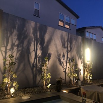 Las Vegas Backyards - night time with wall sconce installed - Landscaping Near Me - Las Vegas, Nevada