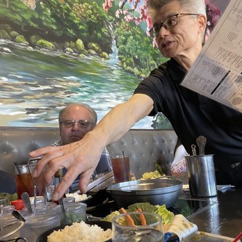 Yoshi Shabu Shabu - Server explaining the process - Japanese Near Me - Plano, Texas Yoshi Shabu Shabu - Server explaining the process - Japanese Near Me - Plano, Texas