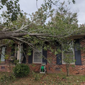 Gardner Tree Service - Limb down across house and porch roof. - Tree Services Near Me