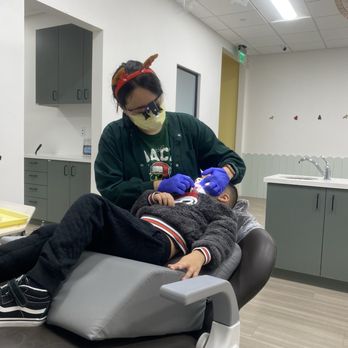 Little Forest Pediatric Dentistry - Dr. Amy checking our son's mouth. - Pediatric Dentists Near Me - Corona, California
