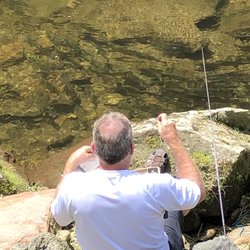River Valley Campground - They had just stocked with trout.  See all of them right at this Fellows fingertips.