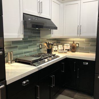 3CM Stone - Tuxedo Kitchen black & white, glass tile backsplash, porcelain countertops, 2" edging and waterfall edge - Building Supplies Near Me - Tualatin, Oregon