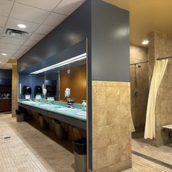 Gold's Gym San Antonio Medical Center - Men's locker room sinks & showers.